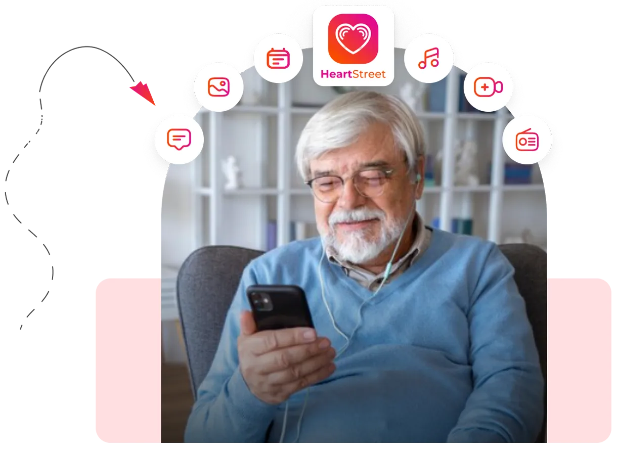 A man sitting in a chair looking at a cell phone