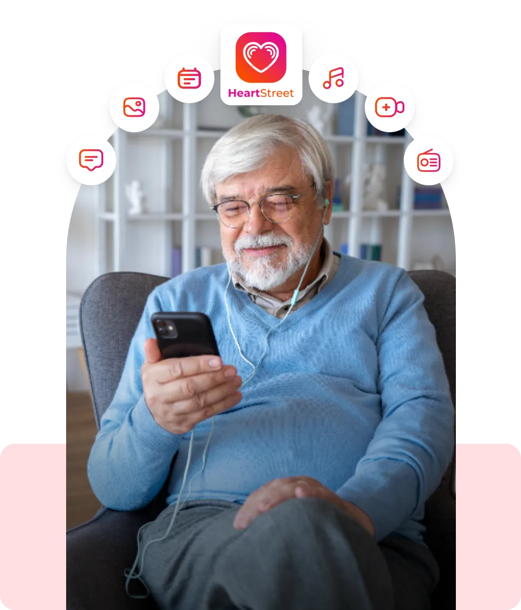 A man sitting in a chair looking at a cell phone